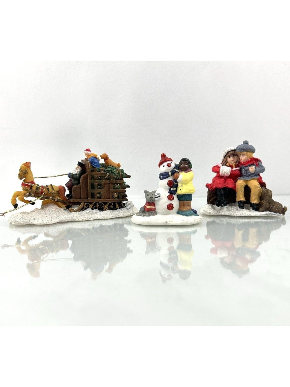 Assorted Christmas Village Figures Snowman Sleigh Ride & Children